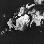 Timothy Leary sits on the stage at the Village Theater, 105 Second Ave., as he hosts his multimedia presentation Illumination of the Buddha, December 6, 1966<br/>